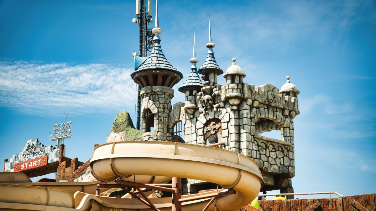 Fake pirate castle at Aquafollie water park in Caorle, the starting point for a yellow enclosed water slide