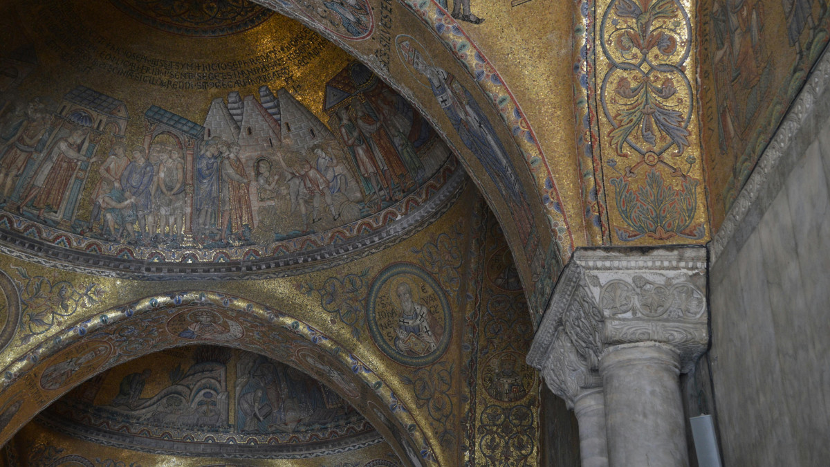 Golden mosaic detail inside St. Mark’s Basilica in Venice, showcasing intricate artwork and historic architecture
