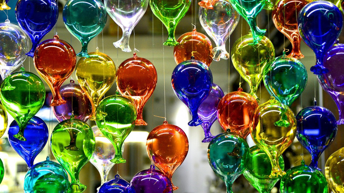 Colorful hand-blown Murano glass balloons hanging in a Venice shop