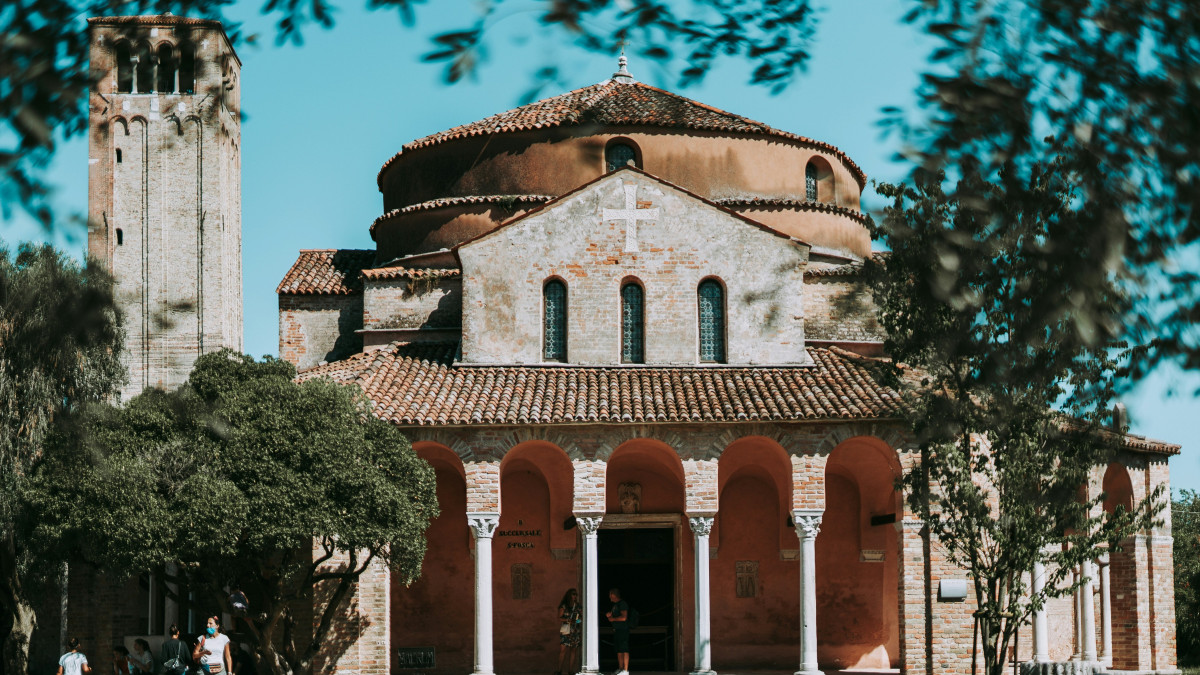 The historical Church of Santa Fosca and bell tower in Torcello island, Venice lagoon.