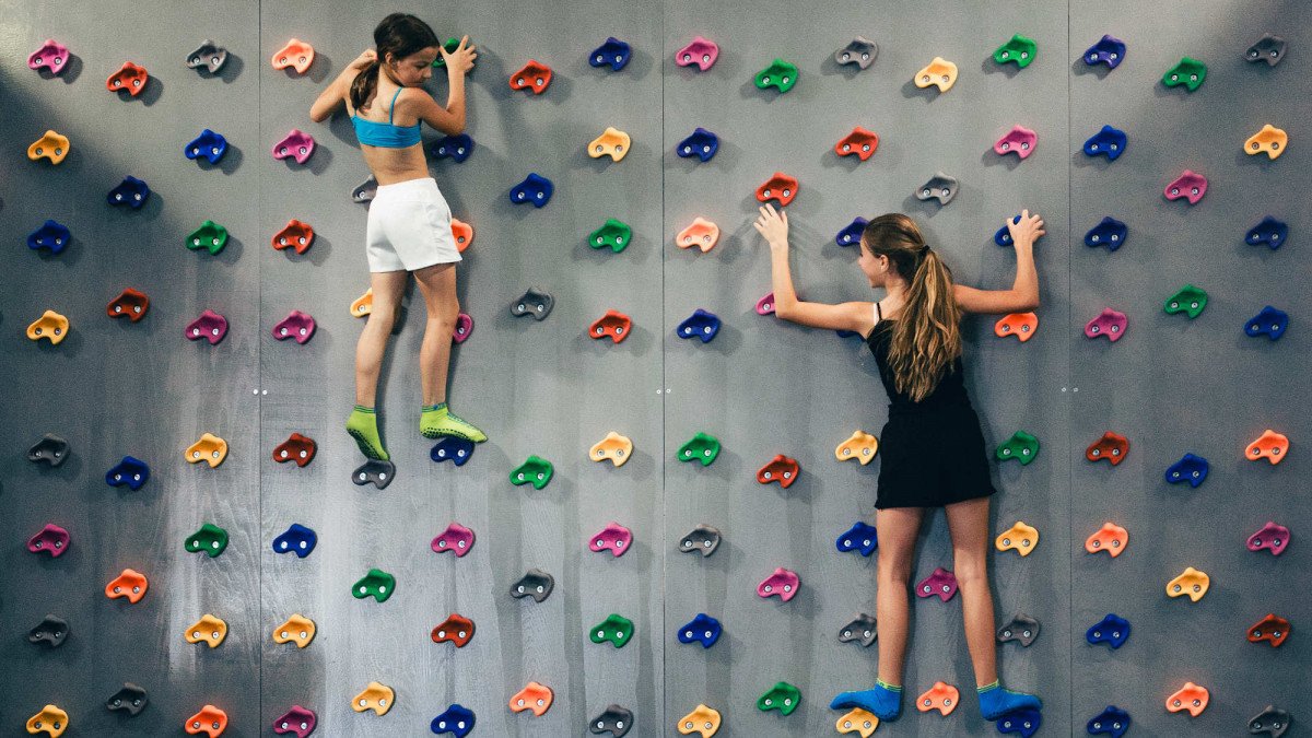 Indoor climbing wall for kids at Just Jump Jesolo; fun bouldering activities and athletic training in a safe environment