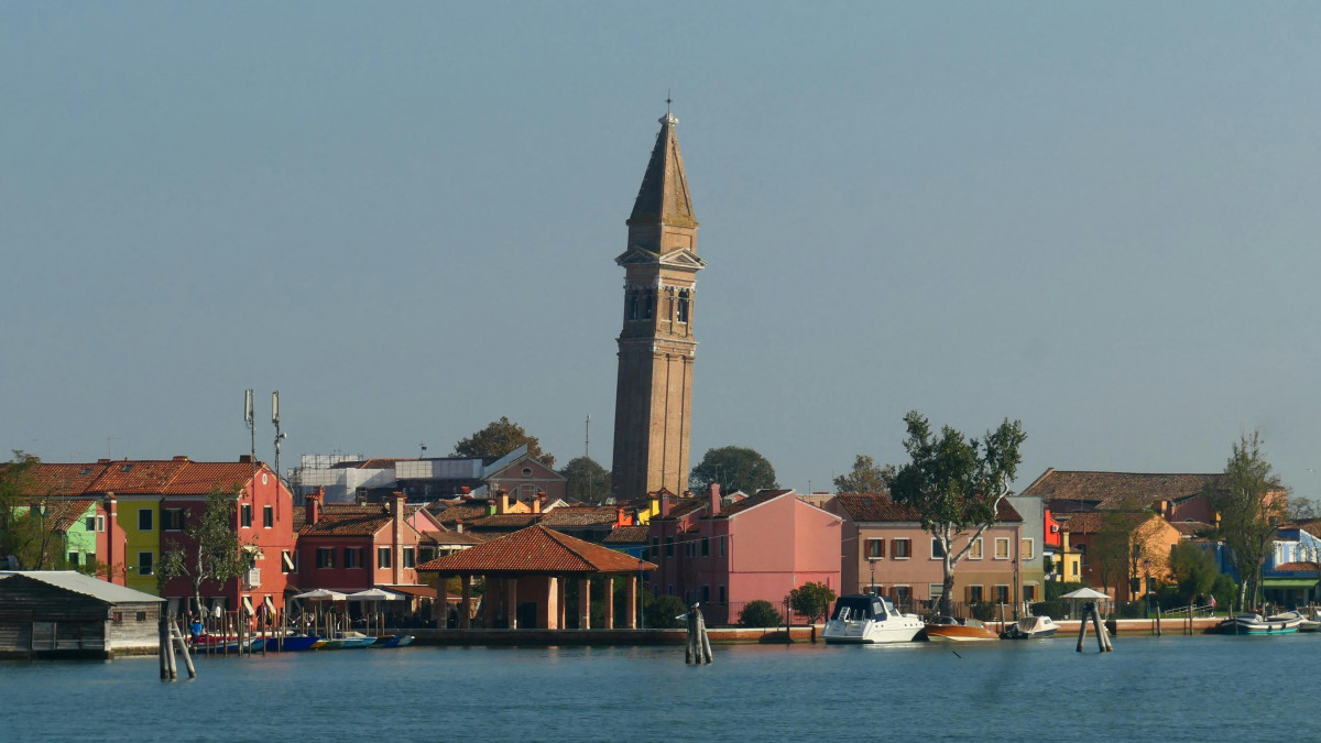 The leaning tower of Burano island in the Venice lagoon; a must-see landmark during a Marco Polo boat excursion from the coast.