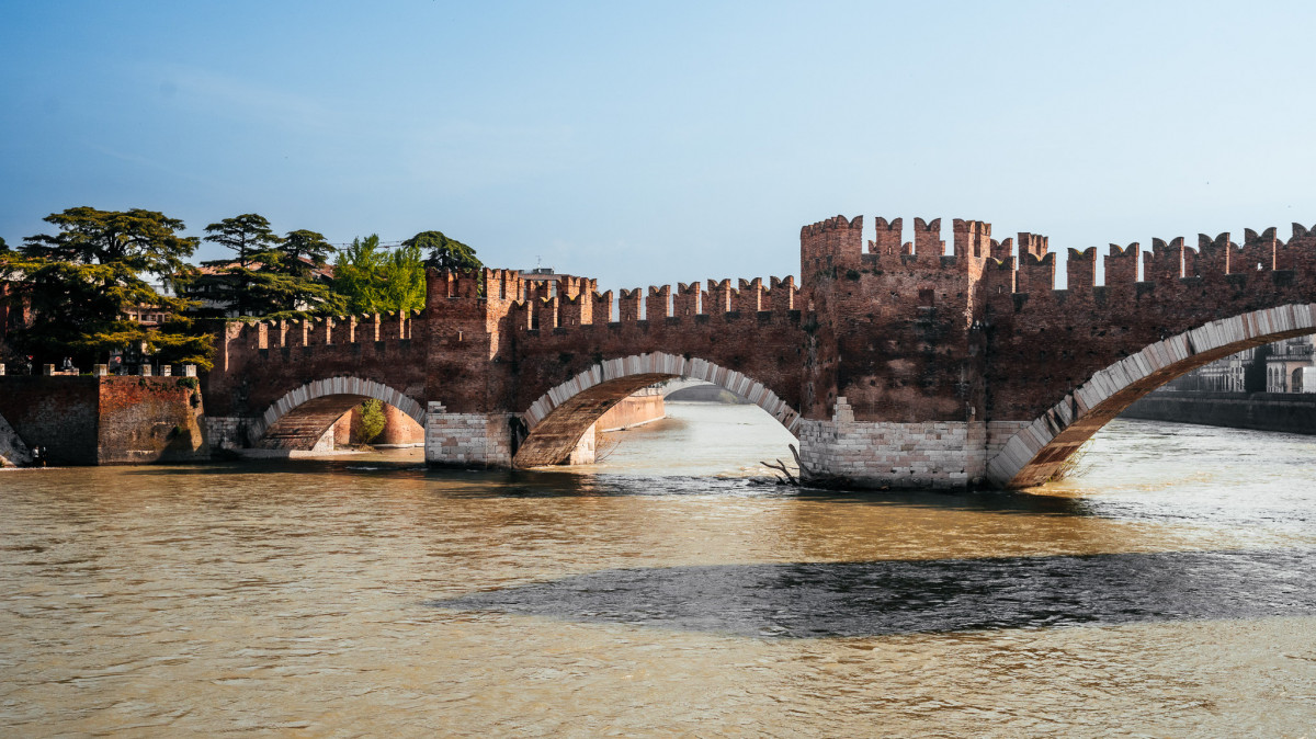 Verona bridge crossing the river with a blue sky in the background