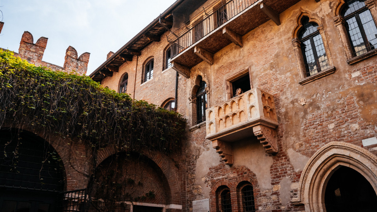 Famous Juliet’s balcony on a red brick building in Verona