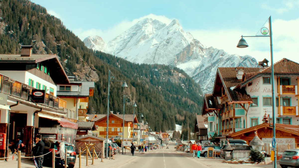 City center of Ortisei with typical houses and the main road