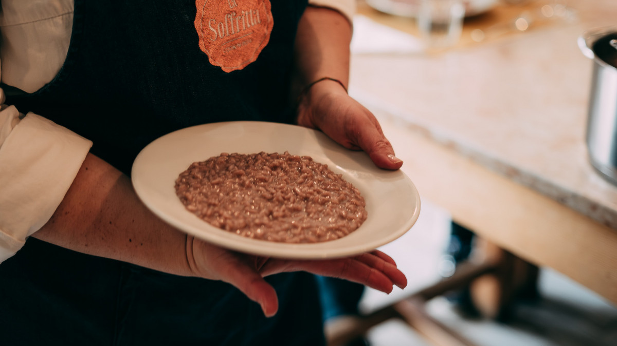 A perfectly plated risotto, creamy and freshly prepared, served on a dish.