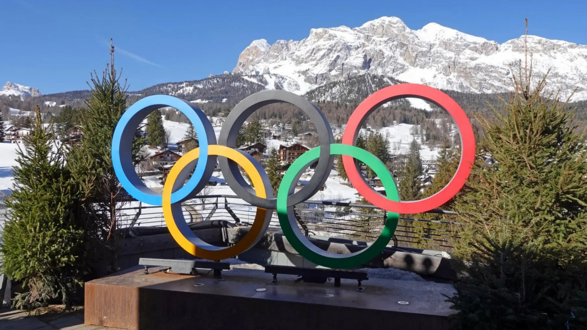 The Olympic rings monument in Cortina d'Ampezzo with the snow-capped Dolomites mountains in the background, Italy.