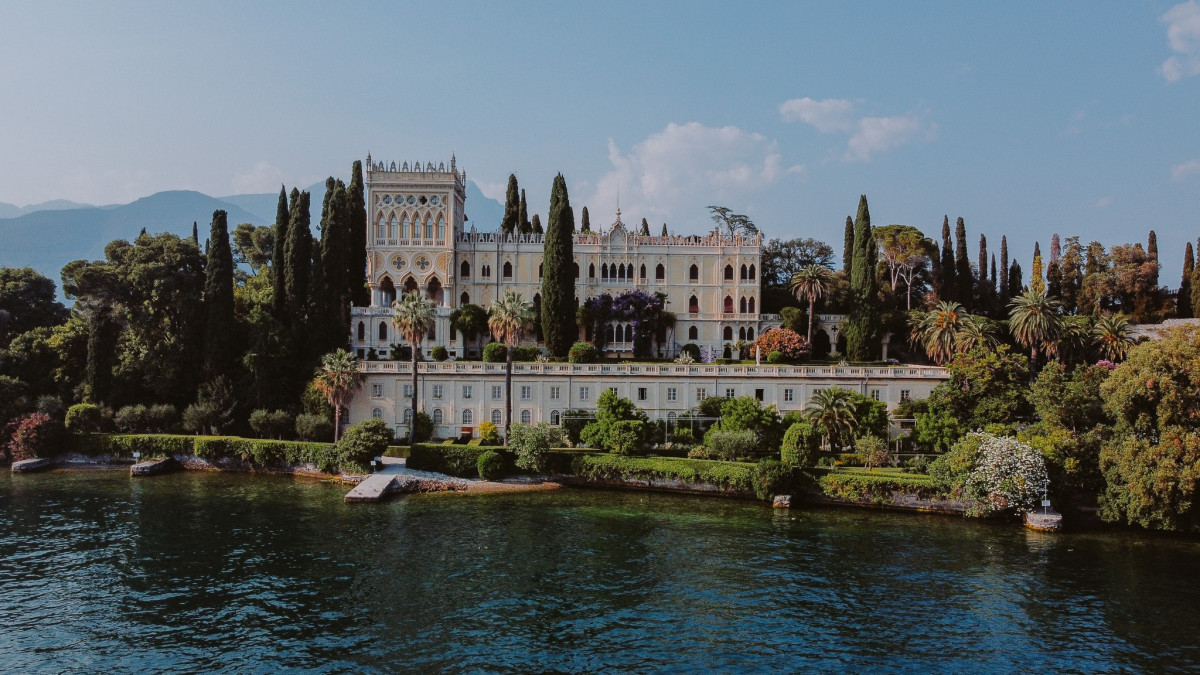 Bertoldi Boats island tour showcasing the neo-Gothic Villa on Isola del Garda, Lake Garda, Italy.