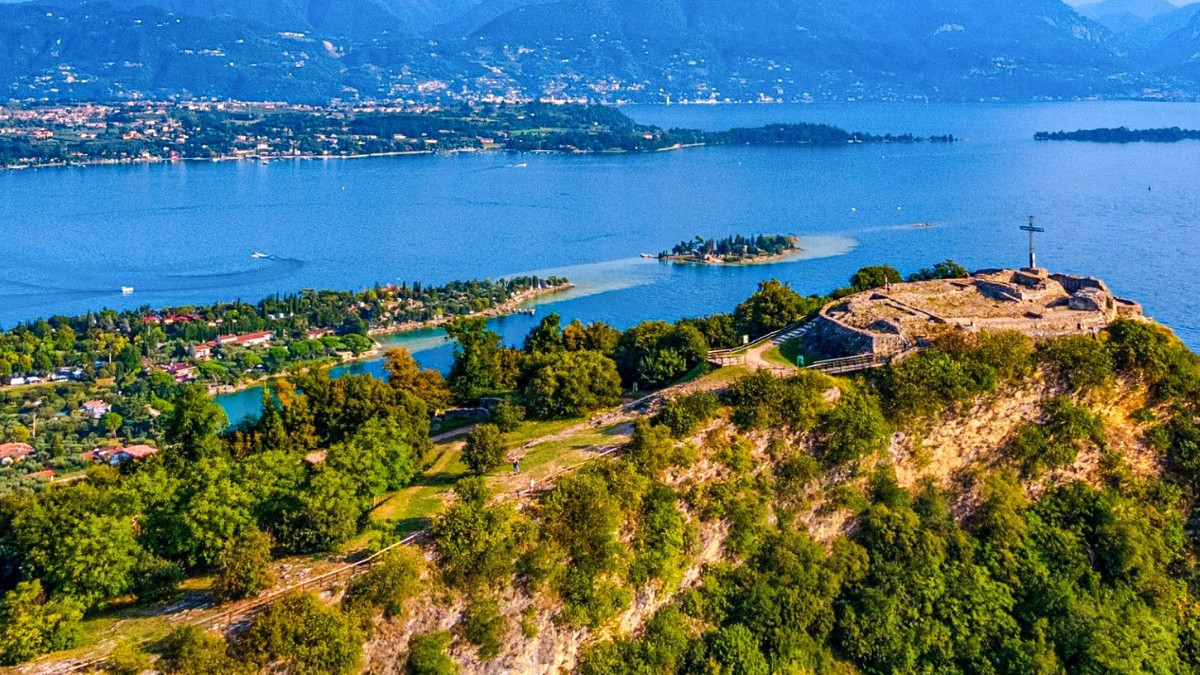 Aerial view of Rocca di Manerba del Garda cliffs and the Isola di San Biagio.