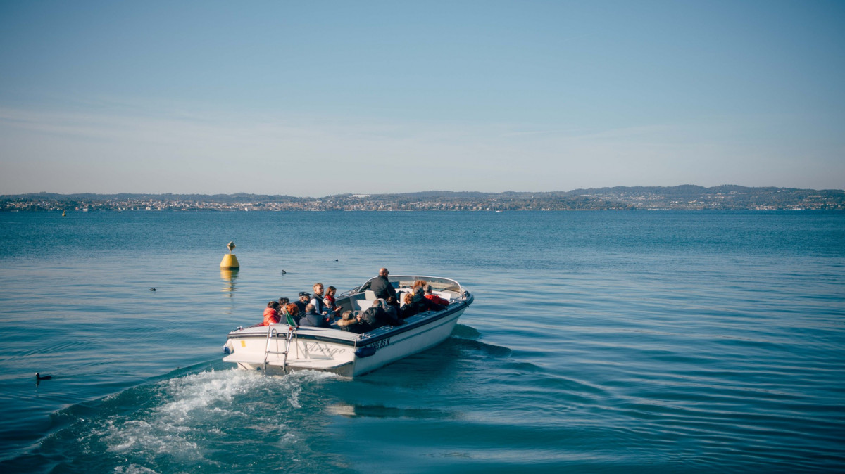 Tourist group on a Bertoldi Boats motorboat tour on Lake Garda.