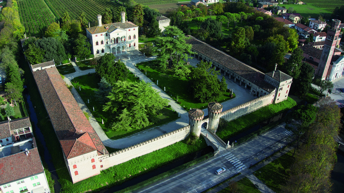 Aerial view of Castello di Roncade in Treviso, a majestic Renaissance villa and wine estate surrounded by medieval walls and lush vineyards.